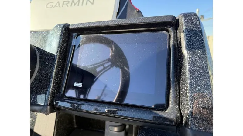 Slide: The Image of Dashboard of 2025 Triton 20XP Patriot boat with Garmin display. - 12