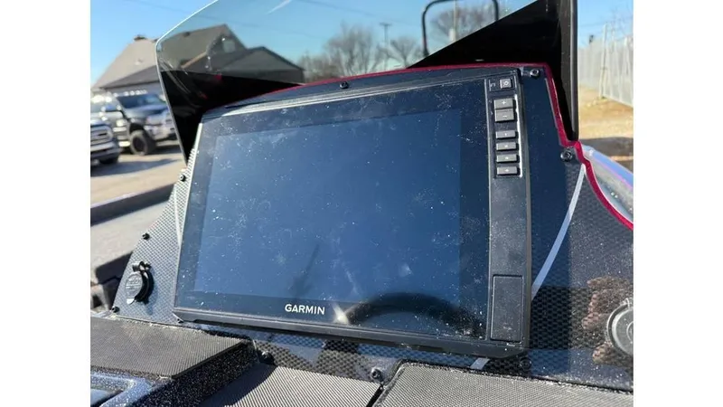 Slide: The Image of Garmin display on 2025 Triton 20XP Patriot boat dashboard, sunny day. - 5