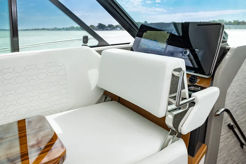 Slide: The Image of 2025 Tiara Yachts 43 LE interior with modern helm and luxurious seating. - 18