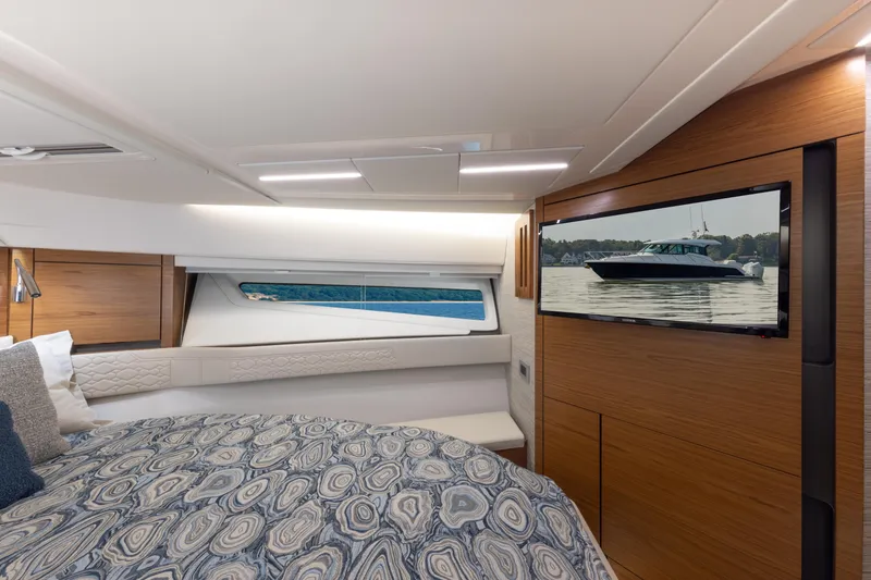 Slide: The Image of Luxurious cabin interior of 2025 Tiara Yachts 43 LE with modern design and scenic window view. - 19