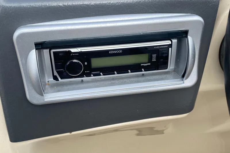 Slide: The Image of Kenwood stereo system in 2014 Godfrey 22 PF boat dashboard. - 12