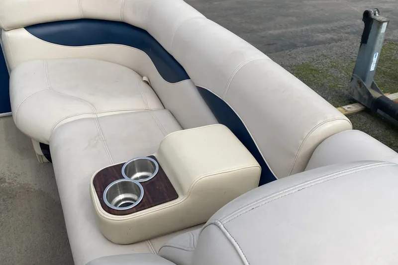 Slide: The Image of Luxurious seating on 2014 Godfrey 22 PF boat with built-in cup holders. - 9