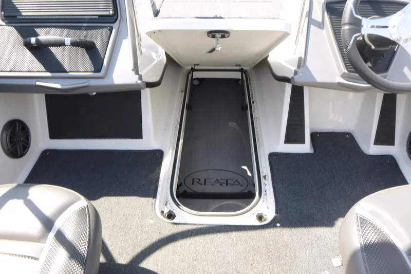 Slide: The Image of 2024 Ranger 1850MS boat interior with storage compartment and seating. - 26