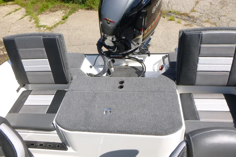 Slide: The Image of 2024 Ranger 1850MS boat interior with Yamaha engine, featuring gray seating and carpeted deck. - 28