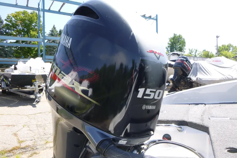 Slide: The Image of 2024 Ranger 1850MS boat with Yamaha 150 outboard motor in a sunny outdoor setting. - 31