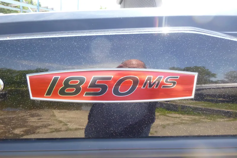 Slide: The Image of 2024 Ranger 1850MS logo on a sparkling black surface. - 32