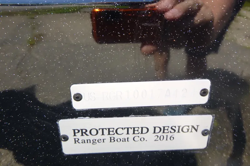 Slide: The Image of 2024 Ranger 1850MS boat with protected design plaque, reflective surface. - 33