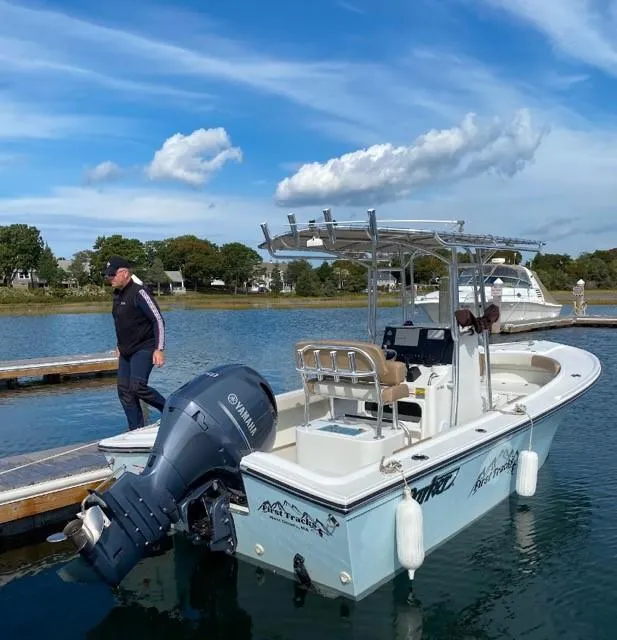 Slide: The Image of 2018 Parker 21SE Center Console boat docked with Yamaha outboard motor. - 10