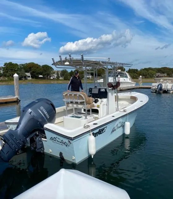 Slide: The Image of 2018 Parker 21SE Center Console boat docked with Yamaha outboard motor. - 8