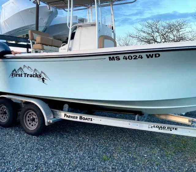 Slide: The Image of 2018 Parker 21SE Center Console boat on trailer, labeled "First Tracks," with registration MS 4024 WD. - 9