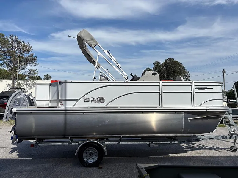 Slide: The Image of 2023 SunCatcher Select 18F pontoon boat on trailer under clear sky. - 0