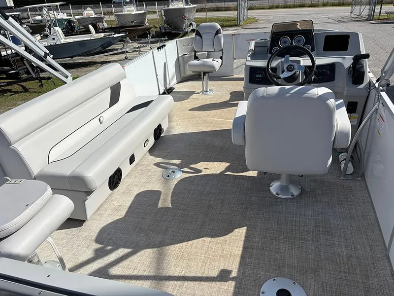 Slide: The Image of 2023 SunCatcher Select 18F boat interior with seating and steering console. - 10