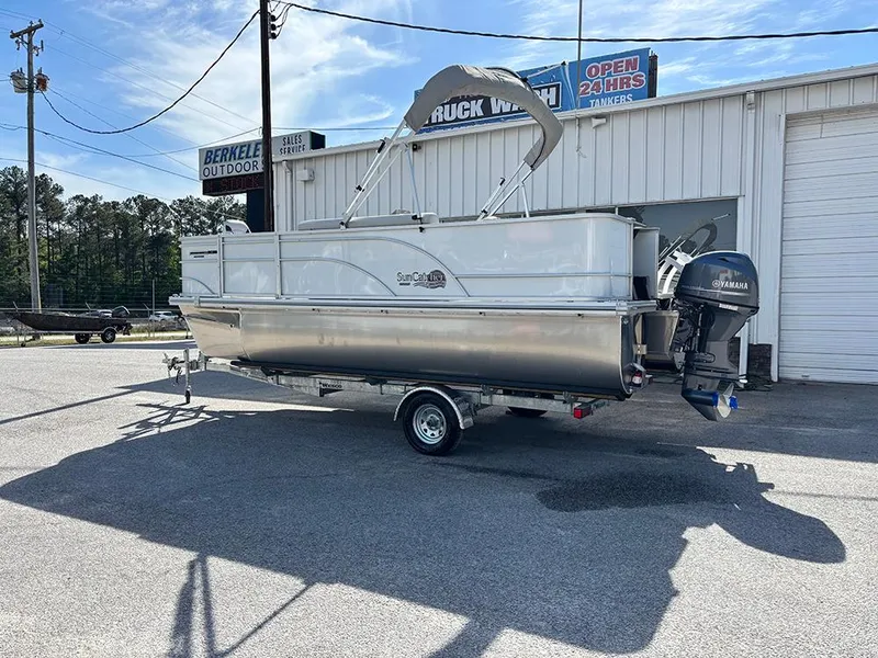 Slide: The Image of 2023 SunCatcher Select 18F pontoon boat with Yamaha motor, parked outside dealership. - 3