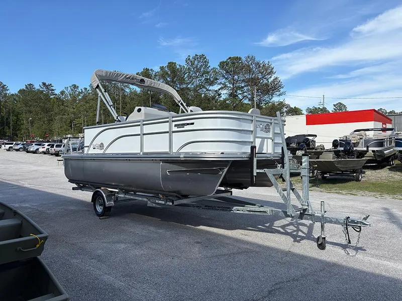 Slide: The Image of 2023 SunCatcher Select 18F pontoon boat on trailer, parked outdoors. - 5