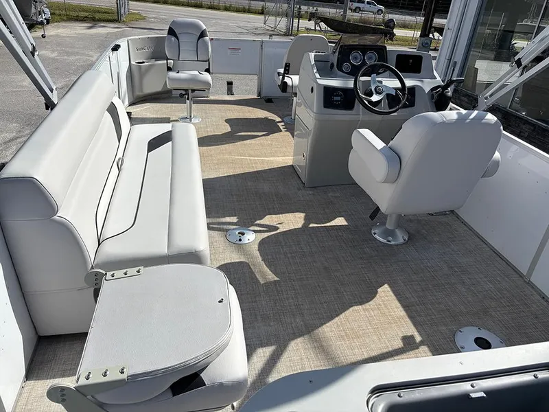 Slide: The Image of 2023 SunCatcher Select 18F boat interior with seating and steering console. - 9