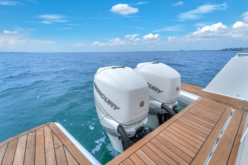 Slide: The Image of Fjord 38 boat with twin Mercury outboard engines on open sea, 2019 model. - 28