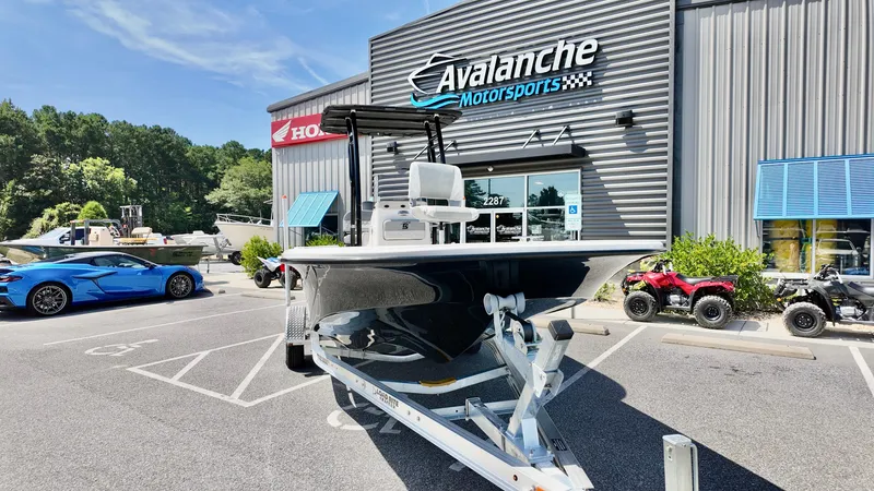 Slide: The Image of 2025 Carolina Skiff 21 LS Stealth Edition boat at Avalanche Motorsports dealership. - 4