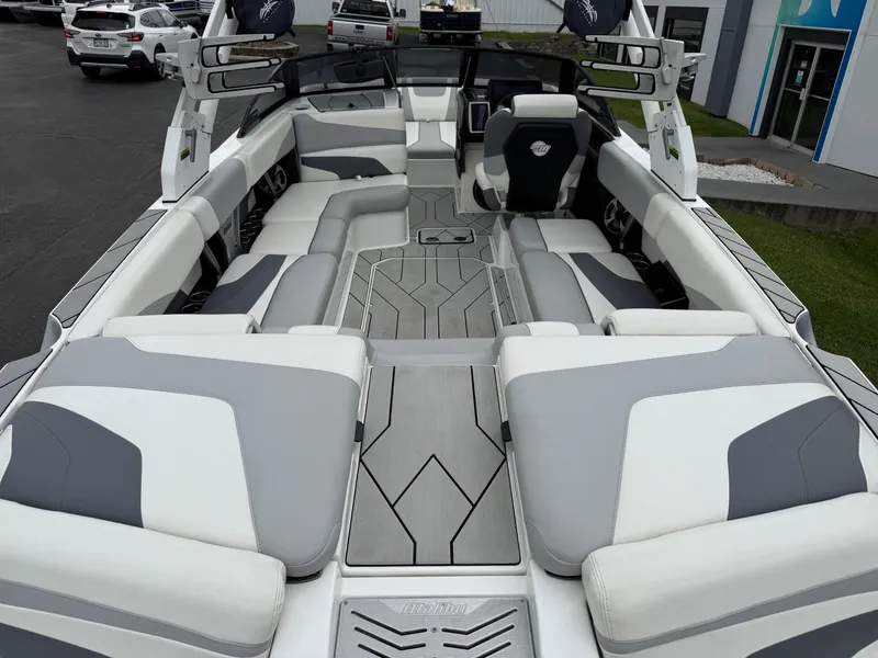 Slide: The Image of 2020 Malibu Wakesetter 24 MXZ interior with spacious seating and modern design. - 11