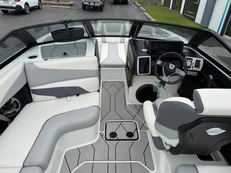 Slide: The Image of 2020 Malibu Wakesetter 24 MXZ interior with modern dashboard and seating. - 14