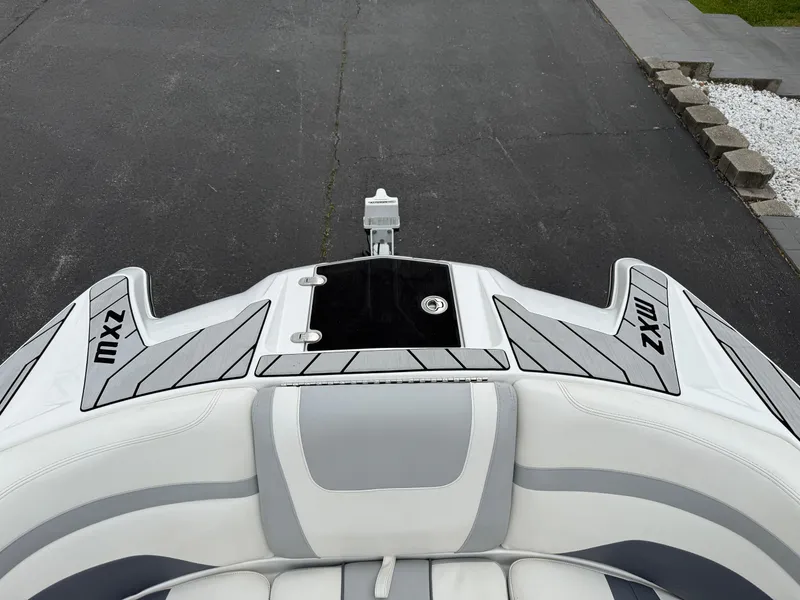Slide: The Image of 2020 Malibu Wakesetter 24 MXZ boat, rear view with sleek design and branding. - 22
