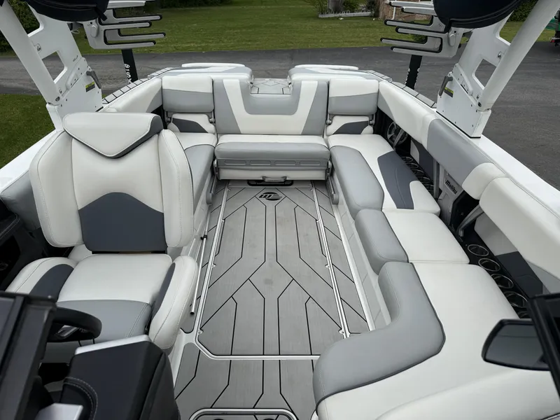 Slide: The Image of 2020 Malibu Wakesetter 24 MXZ interior with luxurious seating and sleek design. - 25