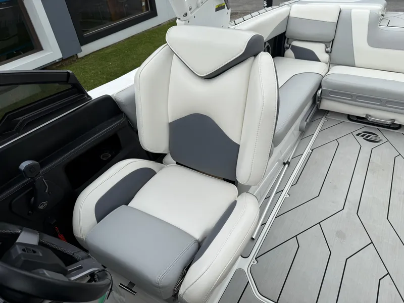 Slide: The Image of Luxury seating in 2020 Malibu Wakesetter 24 MXZ boat, featuring sleek gray and white upholstery. - 27
