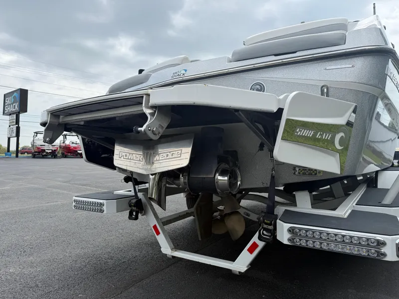 Slide: The Image of 2020 Malibu Wakesetter 24 MXZ boat rear view with propeller and Power Wedge. - 7