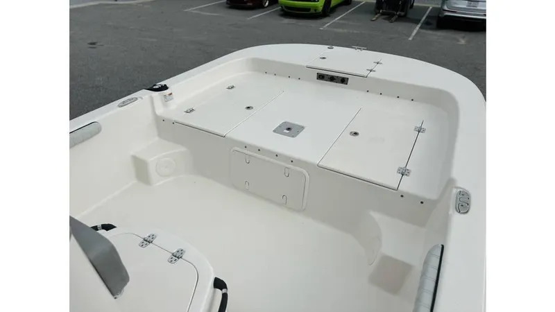 Slide: The Image of 2025 Carolina Skiff 21 LS boat interior with storage compartments and seating. - 11