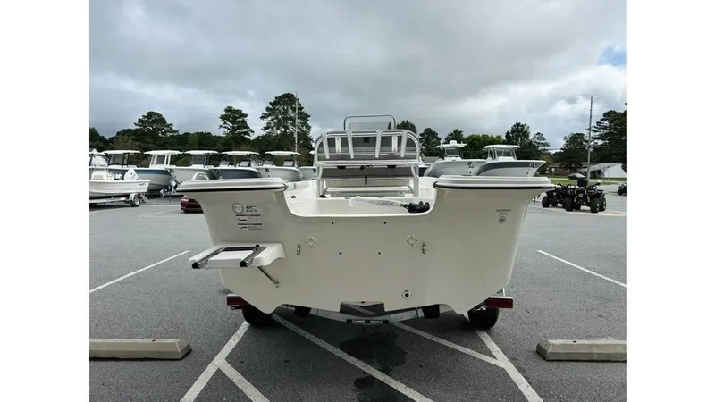 Slide: The Image of 2025 Carolina Skiff 21 LS boat in a parking lot, rear view. - 3