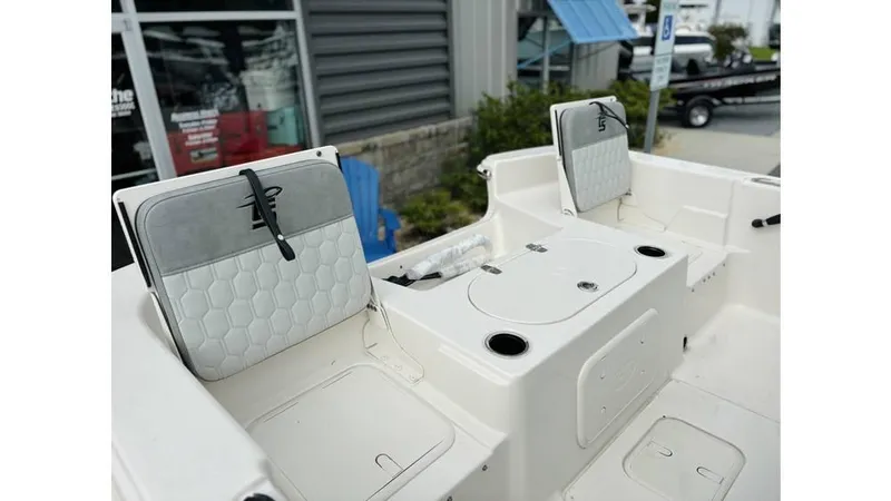 Slide: The Image of 2025 Carolina Skiff 21 LS boat interior with seating and storage compartments. - 5