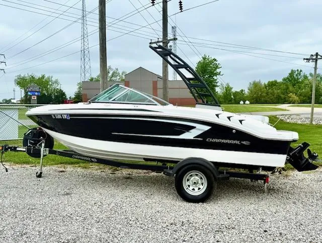 Slide: The Image of 2017 Chaparral H20 19 Sport boat on trailer, parked outdoors. - 1
