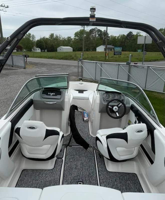 Slide: The Image of 2017 Chaparral H20 19 Sport boat interior with steering wheel and seating. - 3