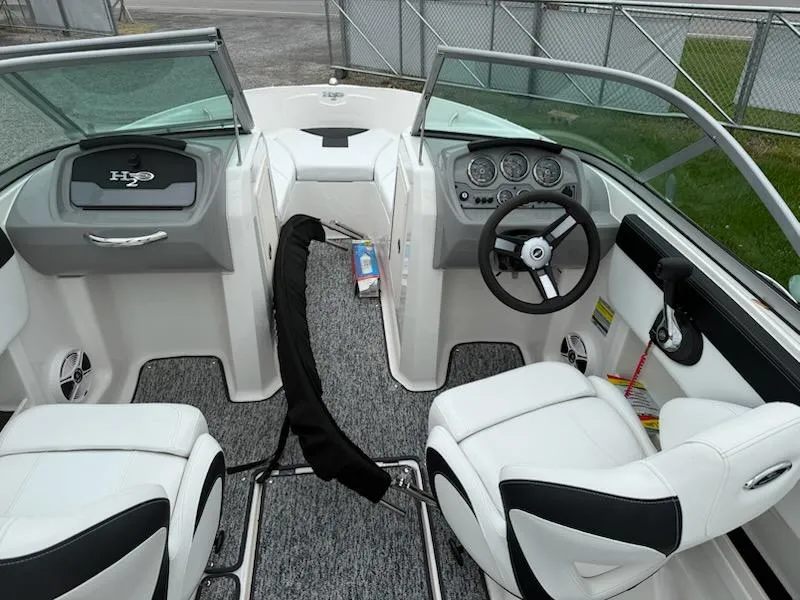 Slide: The Image of 2017 Chaparral H20 19 Sport boat interior with steering wheel and seating. - 4