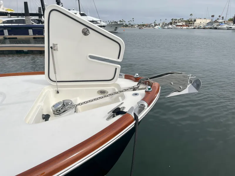 Slide: The Image of 2007 Hinckley Talaria 29 R boat with open anchor compartment, docked in a marina. - 17