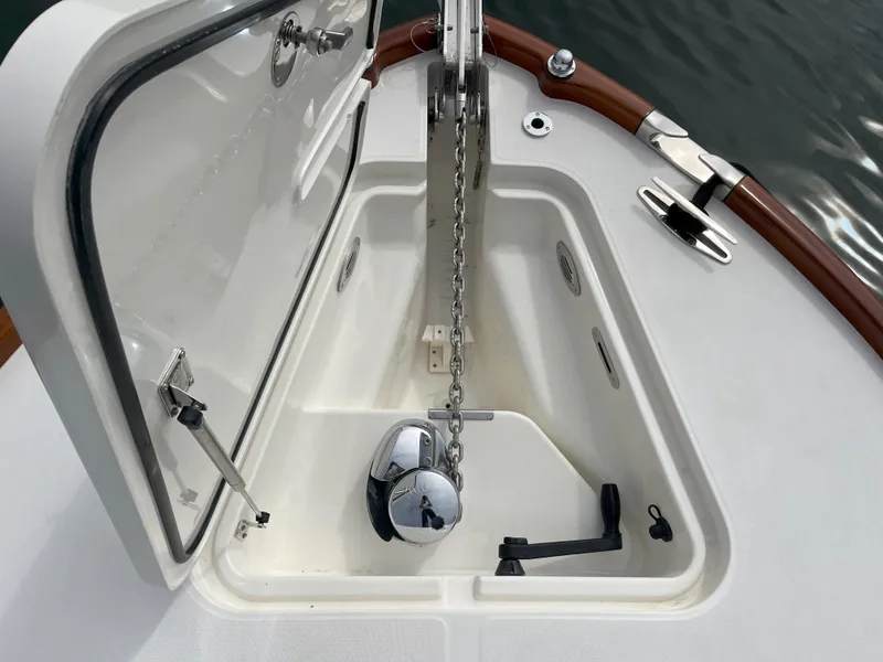Slide: The Image of Anchor compartment of 2007 Hinckley Talaria 29 R boat with chain and winch. - 18