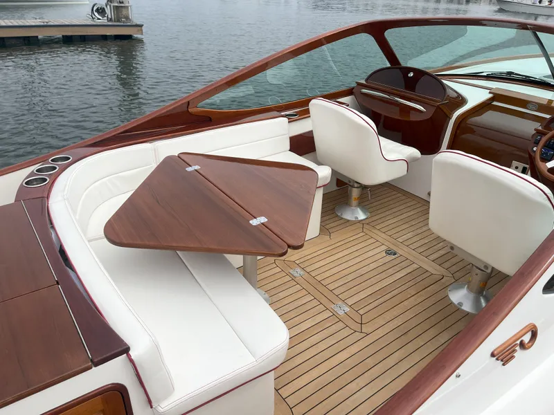 Slide: The Image of Luxurious 2007 Hinckley Talaria 29 R yacht interior with elegant seating and wooden accents. - 22