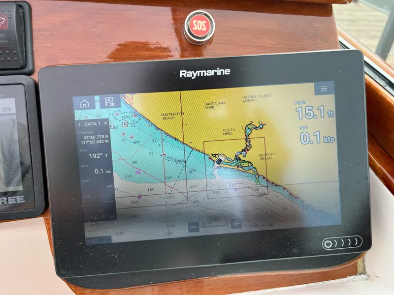 Slide: The Image of Raymarine navigation display on 2007 Hinckley Talaria 29 R boat dashboard. - 30