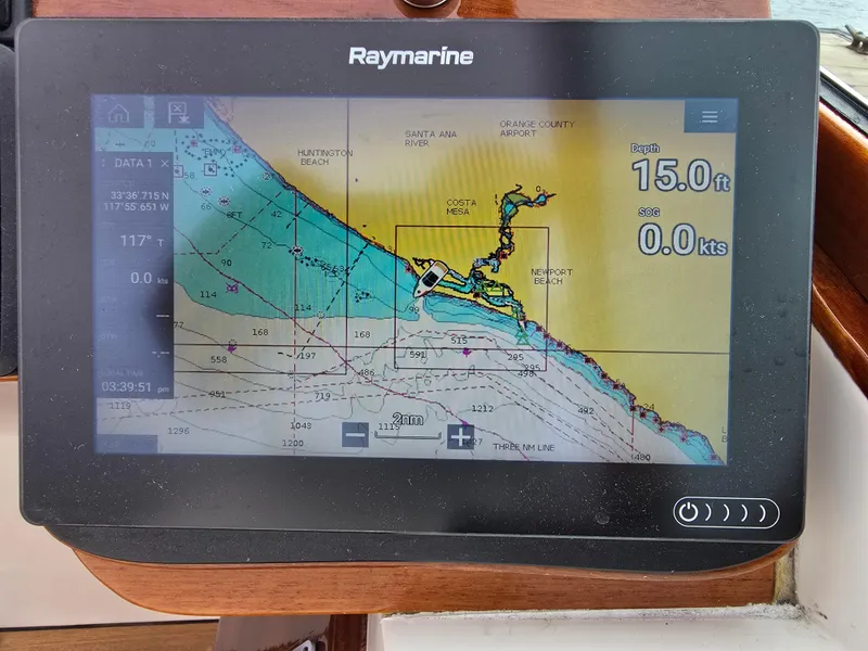 Slide: The Image of Raymarine navigation display on 2007 Hinckley Talaria 29 R, showing coastal map and depth data. - 31
