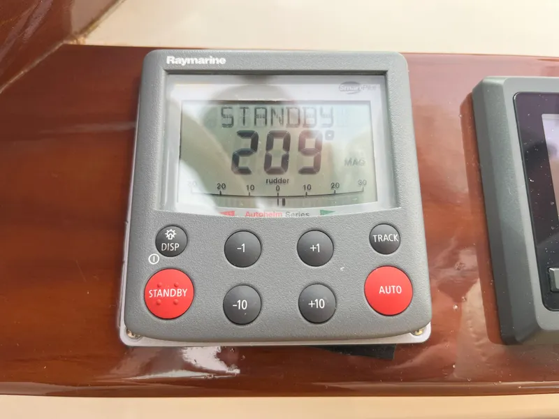 Slide: The Image of Raymarine autopilot display on 2007 Hinckley Talaria 29 R, showing standby mode at 209 degrees. - 33
