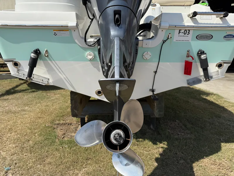 Slide: The Image of 2016 NauticStar 2102 Legacy boat stern with outboard motor and propeller. - 13