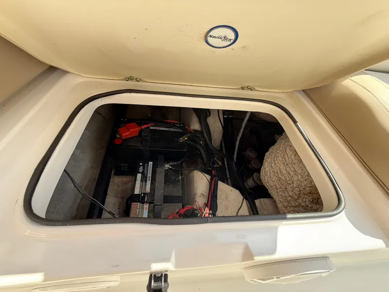 Slide: The Image of 2016 NauticStar 2102 Legacy boat battery compartment with wiring and components. - 17