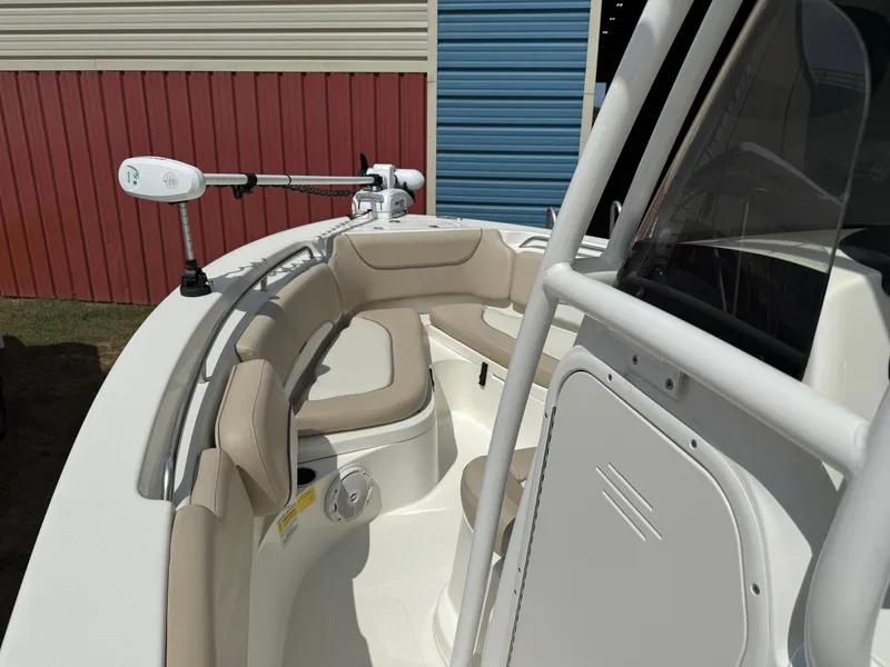 Slide: The Image of 2016 NauticStar 2102 Legacy boat interior with beige seating and mounted equipment. - 7