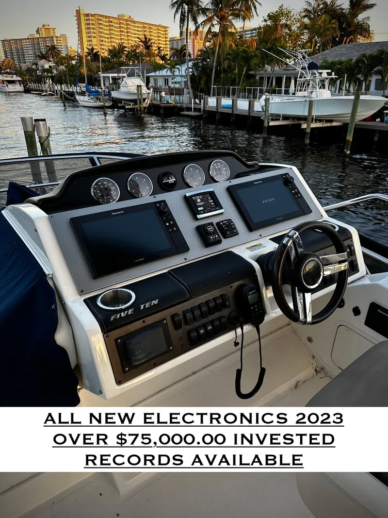 Slide: The Image of Helm of 2015 Sea Ray 510 Fly with new 2023 electronics, docked at marina. - 20