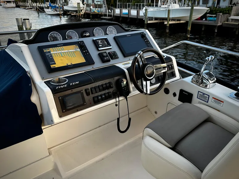 Slide: The Image of Helm of 2015 Sea Ray 510 Fly yacht with modern navigation equipment. - 21