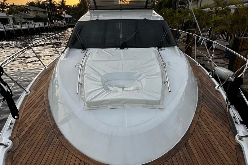 Slide: The Image of 2015 Sea Ray 510 Fly yacht with sleek deck design at sunset. - 23