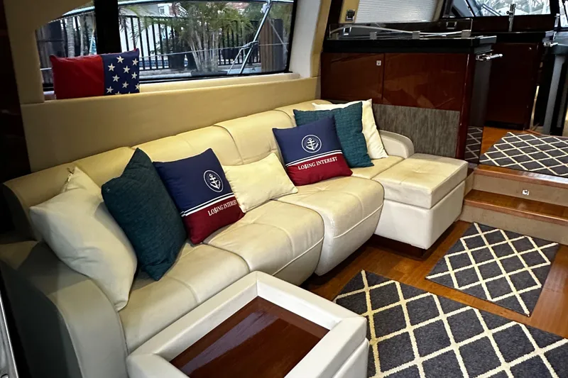 Slide: The Image of Luxurious interior of 2015 Sea Ray 510 Fly yacht with plush seating and nautical decor. - 26