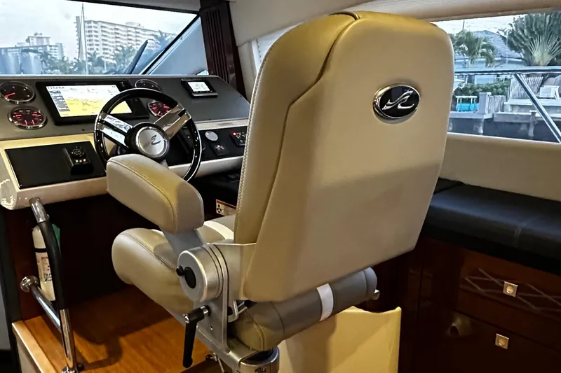 Slide: The Image of Luxurious helm of 2015 Sea Ray 510 Fly yacht with modern controls and leather seating. - 31
