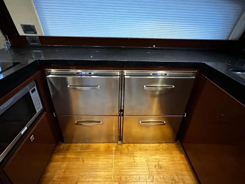 Slide: The Image of Modern kitchen area in a 2015 Sea Ray 510 Fly yacht with stainless steel appliances. - 36