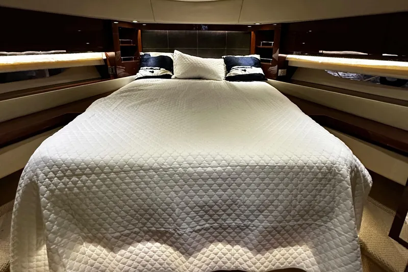 Slide: The Image of Luxurious bedroom interior of 2015 Sea Ray 510 Fly yacht with elegant bedding. - 39
