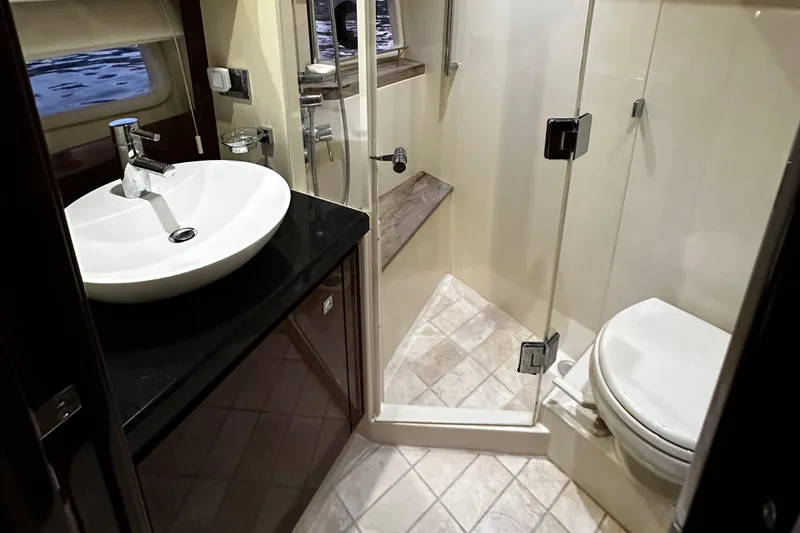 Slide: The Image of Luxurious bathroom in 2015 Sea Ray 510 Fly yacht with modern fixtures and glass shower. - 43